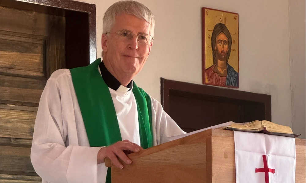 Father Ray McHenry says Mass at St. Faustina Parish in Rebone