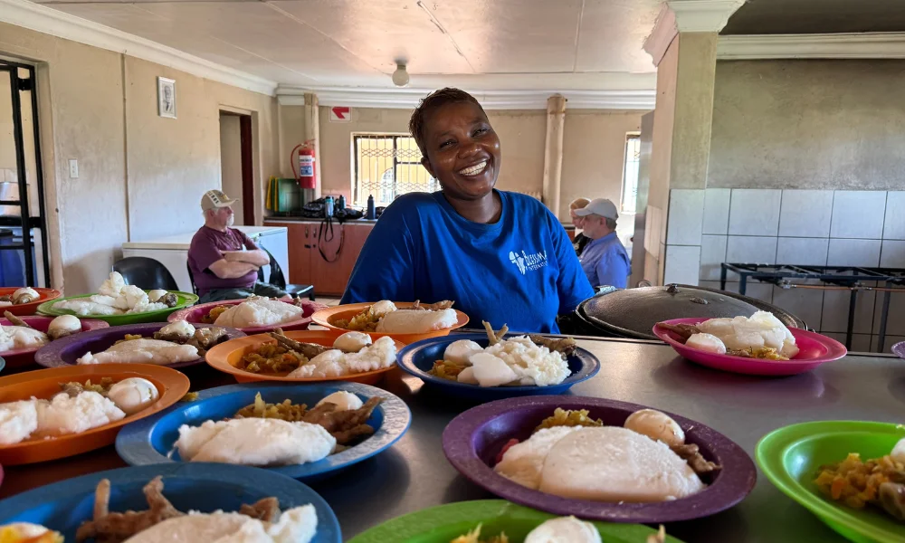 Woman serving a meal at an after-school food program in