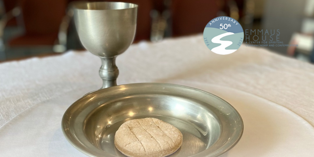 Image of a chalice and bread on a paten