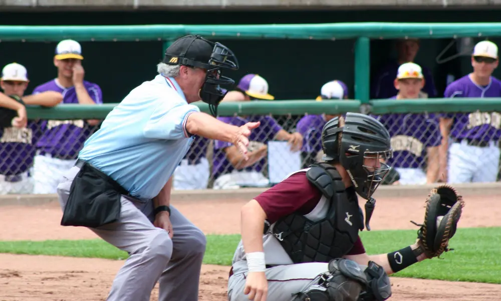 Father Greg Leach volunteering as an umpire