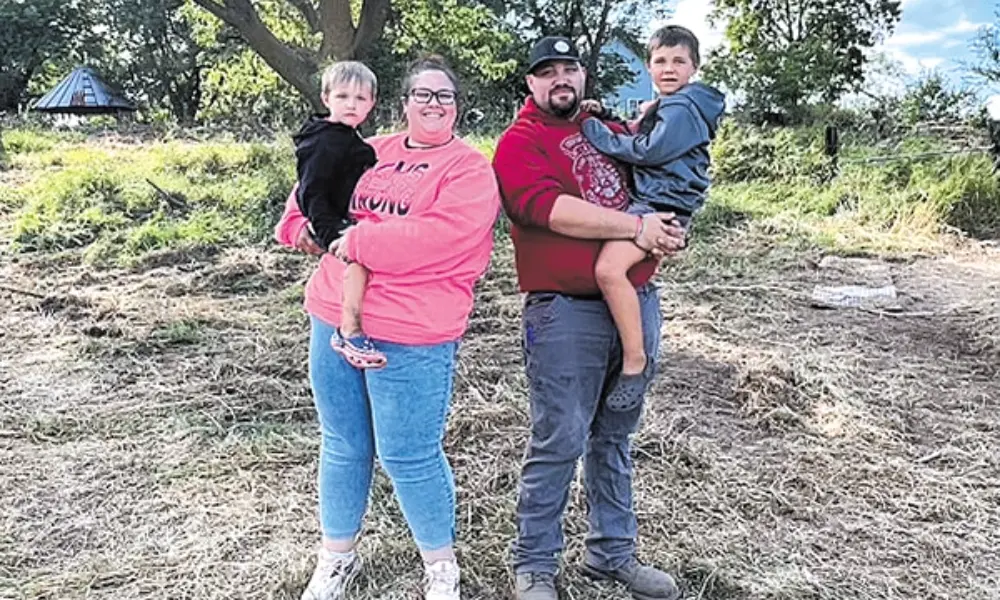 The Vry family on land where they plan to build a new h