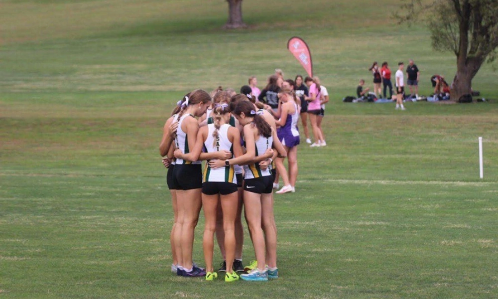 The St. Albert team gathering for prayer before a race